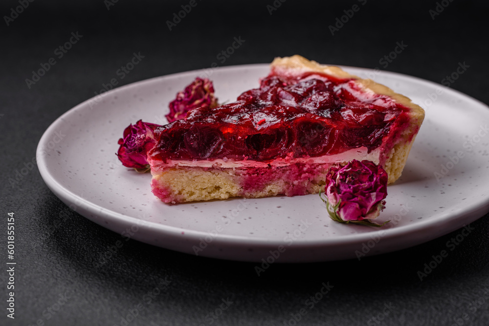 Delicious fragrant sweet pie with cherry berries on a ceramic plate Delicious fragrant sweet pie with cherry berries on a ceramic plate