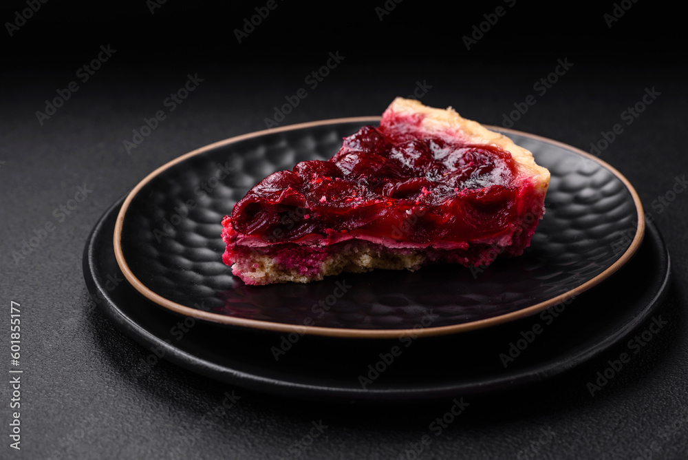 Delicious fragrant sweet pie with cherry berries on a ceramic plate Delicious fragrant sweet pie with cherry berries on a ceramic plate