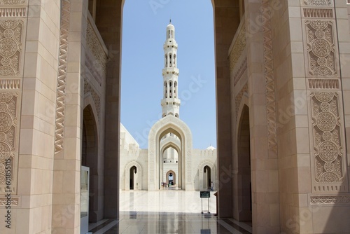 Minaret of Sultan Qaboos grand mosque seen from the arch of lateral entrance, Muscat, Oman