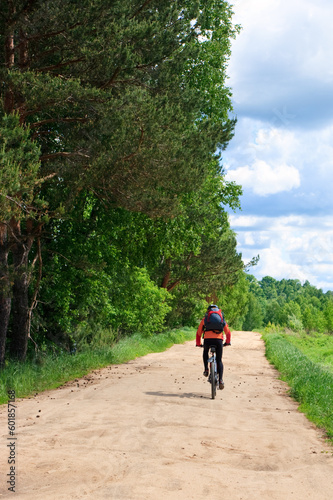 Traveling cyclists on dirt road