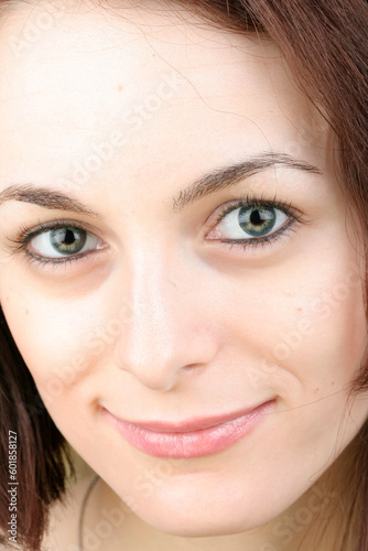 Beautiful happy woman with green eyes.