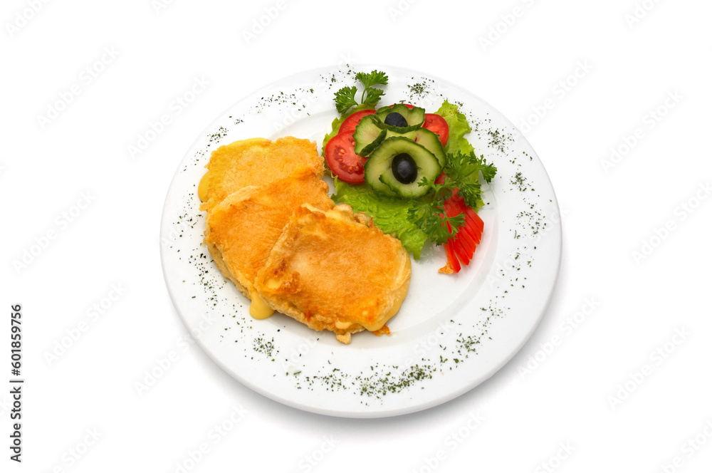 deep fried cheese in egg, with fresh vegetables, served on plate. deep fried cheese in egg, with fresh vegetables, served on plate.