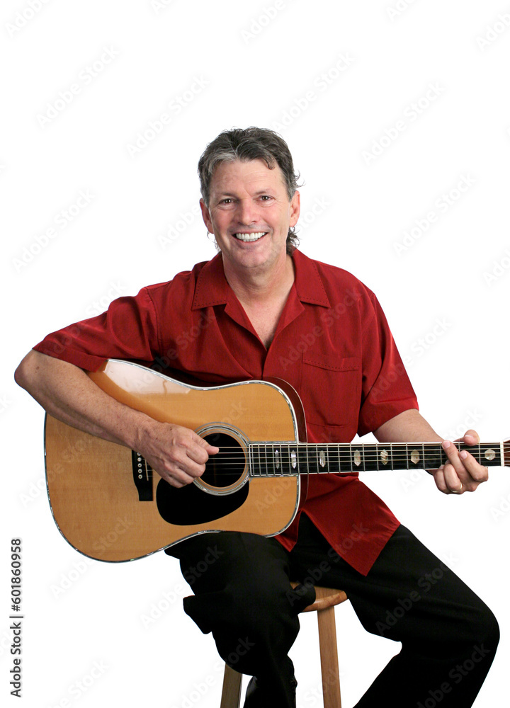 A handsome folk musician playing a tune on his guitar. Isolated. A handsome folk musician playing a tune on his guitar. Isolated.