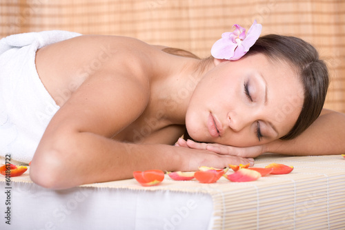 attractive brunette woman relaxing in massage