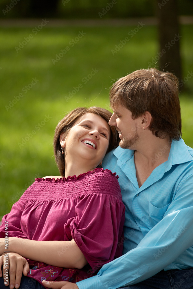 Embraces of a happy married couple in park Embraces of a happy married couple in park