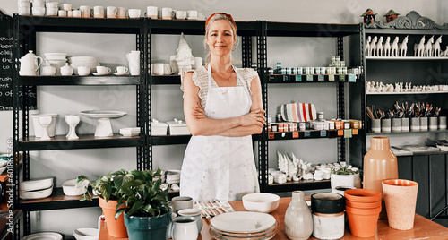 Happy woman, portrait and pottery with arms crossed in small business confidence for crafting in retail store. Confident female person, ceramic designer or owner smiling for craft or creative startup