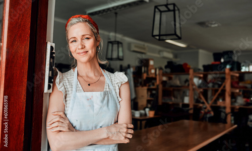 Happy woman, portrait and arms crossed in small business confidence at entrance for workshop in retail store. Confident female person, ceramic designer or owner smiling for craft or creative startup