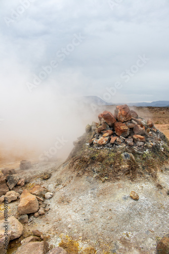 Fumarole evacuating pressurized hot sulfurous gases from volcanic activity in the geothermal area in Iceland