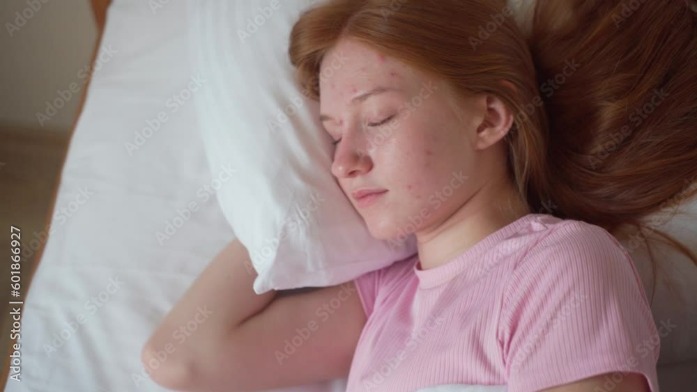 Happy sleepy young red hair teenage girl awaking up lying in comfortable white bed. Positive pretty ginger teenager stretching enjoying early good morning in cozy bedroom. Fresh lazy lady awakes after Happy sleepy young red hair teenage girl awaking up lying in comfortable white bed. Positive pretty ginger teenager stretching enjoying early good morning in cozy bedroom. Fresh lazy lady awakes after