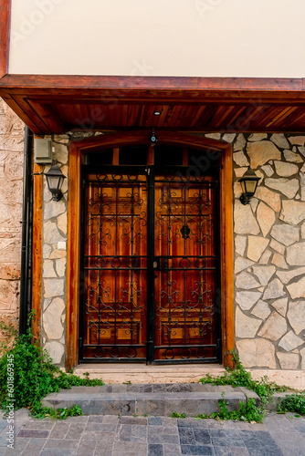 Vintage door in the building of the historical district of Konyaalti in the city of Antalya. Wooden door in Konyalti in the Turkish city of Antalya.