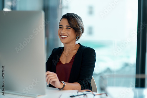 Computer, happy and business woman with online solution, software management and reading company review. Working, website planning and smile of professional worker or person on desktop pc in office