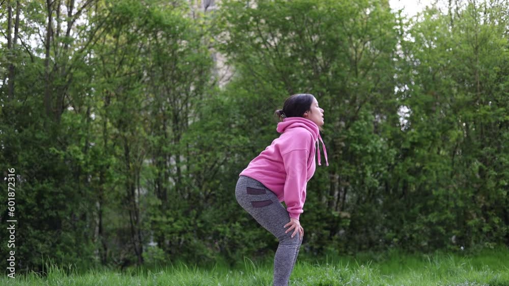 woman running and exercising in park.weight loss concept,after childbirth recovery.get slim fit, dieting.girl in pink hoodie tie laces.people walking in forest with dogs.overweight concept,postpartum woman running and exercising in park.weight loss concept,after childbirth recovery.get slim fit, dieting.girl in pink hoodie tie laces.people walking in forest with dogs.overweight concept,postpartum