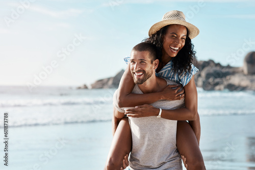 Romance, ocean and piggy back, happy couple with blue sky on romantic summer holiday travel to beach. Love, man and woman at sea, happiness on date and romantic adventure vacation together in Mexico.