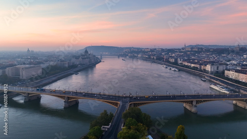Aerial view of Budapest Margaret Bridge or Margit hid over River Danube, embankment at sunrise. Public transport in the city