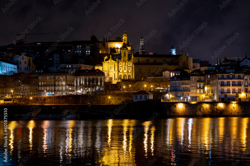 Night view of the Douro river and the old town of Porto.