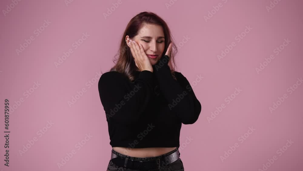 4k video of one girl posing for a video over pink background. 4k video of one girl posing for a video over pink background.
