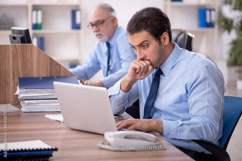 Two male colleagues working in the office Two male colleagues working in the office