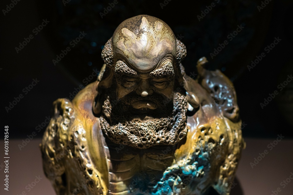 statue of a person with gold crown statue of a person with gold crown
