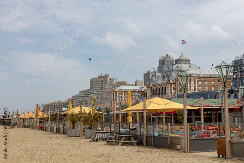 Beach tent seaside coast bars and restaurants at popular Dutch tourist destination. 