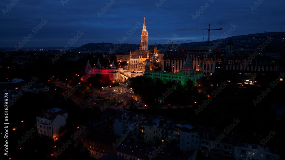 Establishing Aerial View Shot of Matthias church and Fishermans Bastion at night. Budapest, Hungary