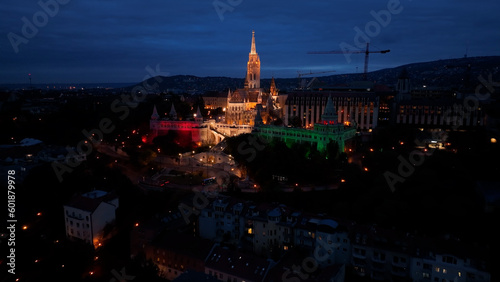 Establishing Aerial View Shot of Matthias church and Fishermans Bastion at night. Budapest, Hungary