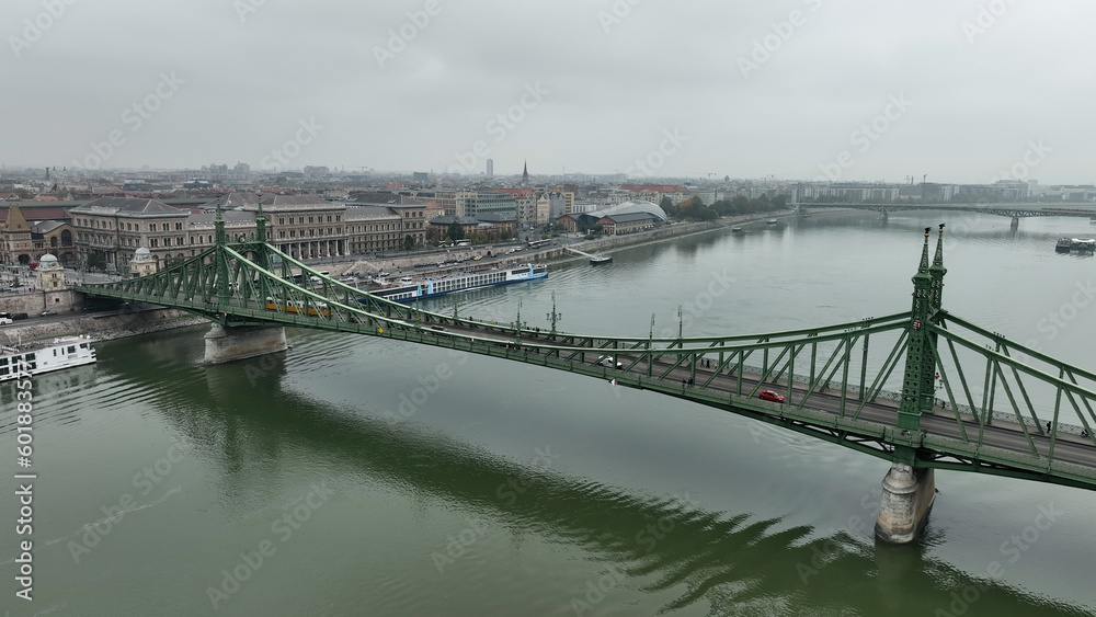 Aerial view of Budapest Szabadsag hid (Liberty Bridge or Freedom Bridge), connects Buda and Pest across the River Danube. A tram circulates