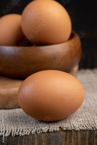 A whole orange chicken egg close-up on the table