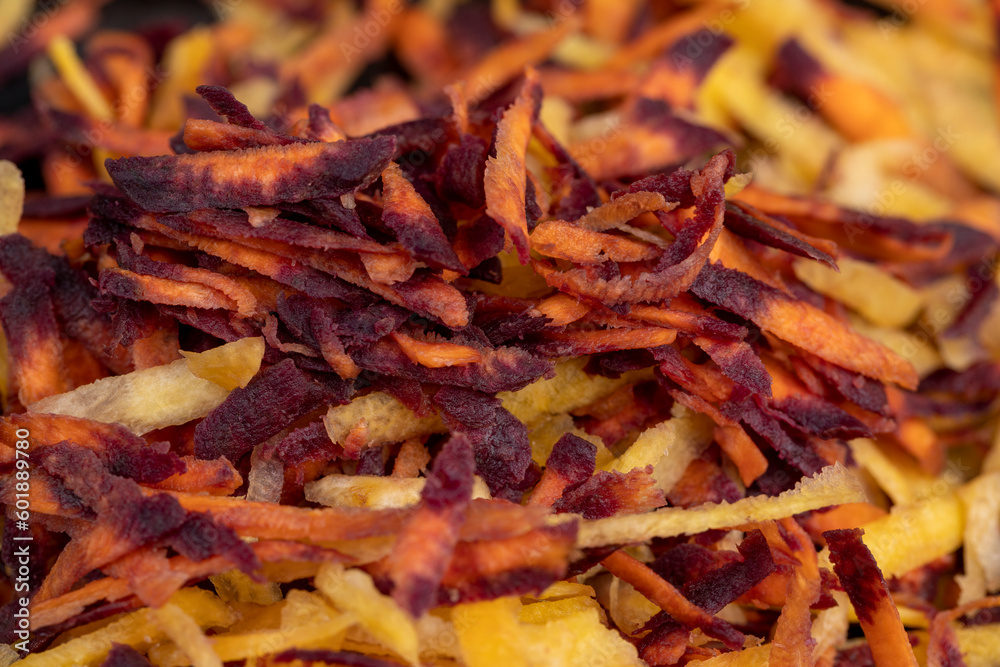 Sliced into thin slices of red-orange carrots in the kitchen Sliced into thin slices of red-orange carrots in the kitchen