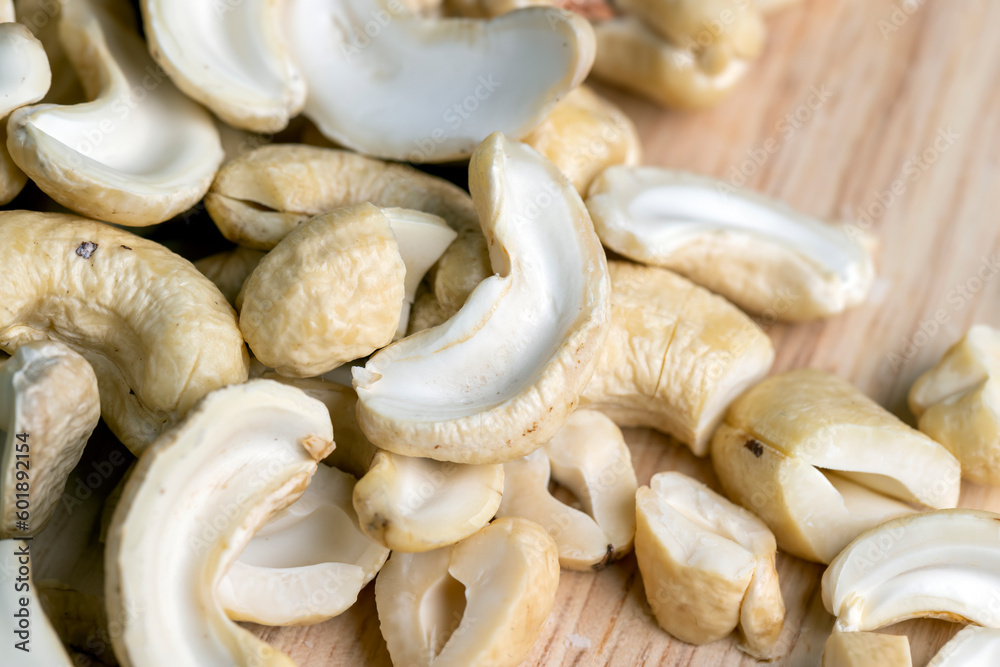 Hard roasted and peeled cashew nuts on the table Hard roasted and peeled cashew nuts on the table