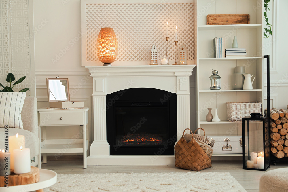 Stylish living room with beautiful fireplace and different decor. Interior design Stylish living room with beautiful fireplace and different decor. Interior design