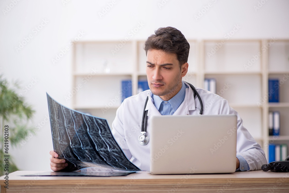 Young male doctor radiologist working in the clinic Young male doctor radiologist working in the clinic