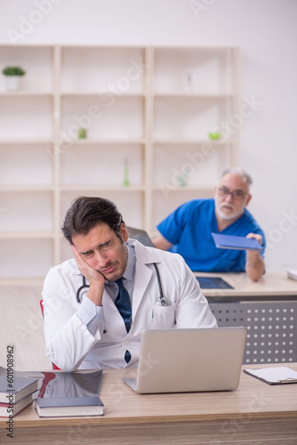 Two male doctors working in the clinic