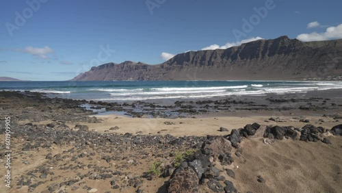 Dramatic coastline and beach at Caleta de Famara, Caleta de Famara, Las Palmas, Lanzarote photo