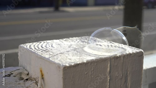 Turning Soap Bubbles into Ice Domes from the Side photo