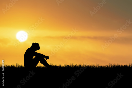 The concept of loneliness, heartbreak, unemployment, forsaken God. Silhouette of a Desperate Man in the Prairie
