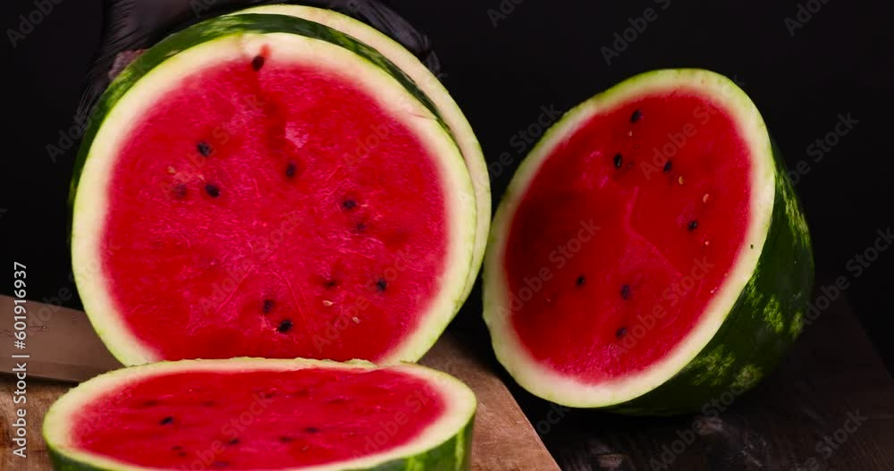 Ripe red watermelon with black seeds, ripe and sweet red watermelon cut into pieces Ripe red watermelon with black seeds, ripe and sweet red watermelon cut into pieces