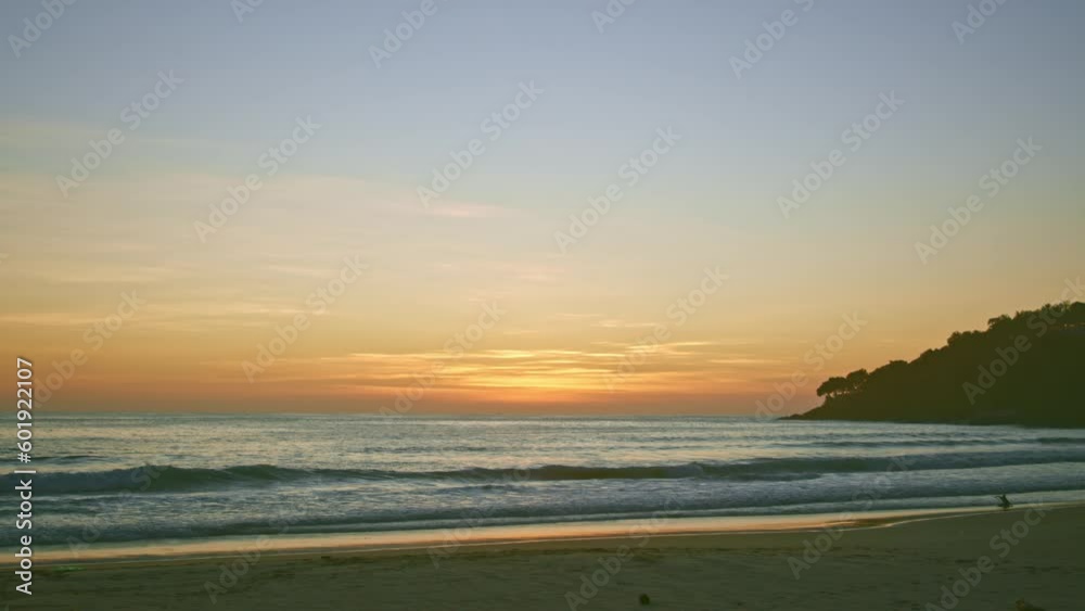 sweet sky at sunset. Gradient color. Sky texture, abstract nature background..Sunset with strong color light rays and other atmospheric effects...big waves hit the beach at sunset..
