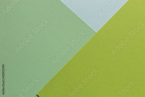 The paper green colors is lying on the table