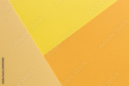 The paper yellow and orange colors is lying on the table
