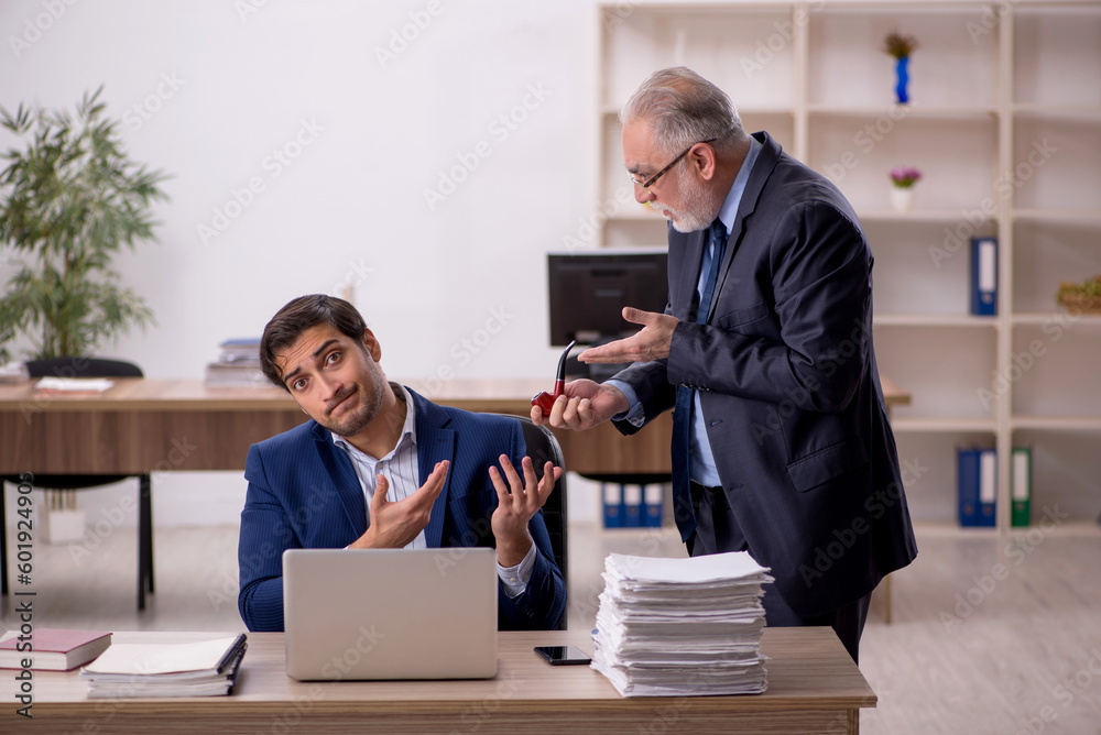 Two male colleagues working in the office Two male colleagues working in the office