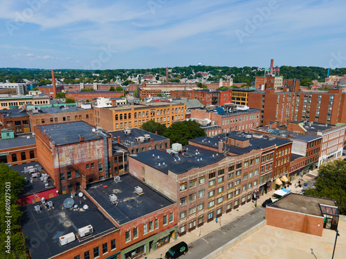 Foto Historic commercial buildings on Market Street with Boott Mills at the background in downtown Lowell, Massachusetts MA, USA