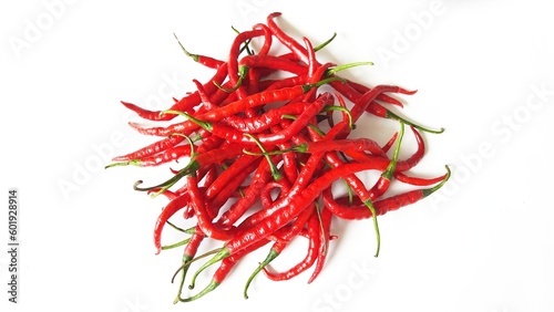 Cabai merah keriting or red hot chili peppers spicy blurred defocus isolated on white background photo