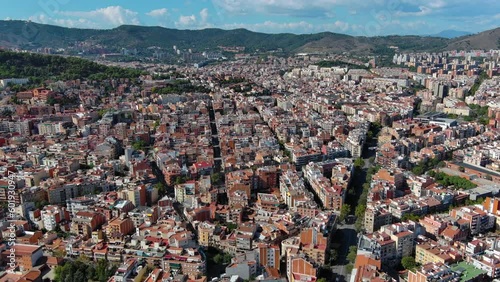 Barcelona city skyline, aerial view of Horta Guinardo and Nou Barris districts during a sunny day photo