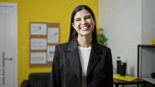 Wallpaper Mural Young beautiful hispanic woman business worker smiling confident at office Torontodigital.ca