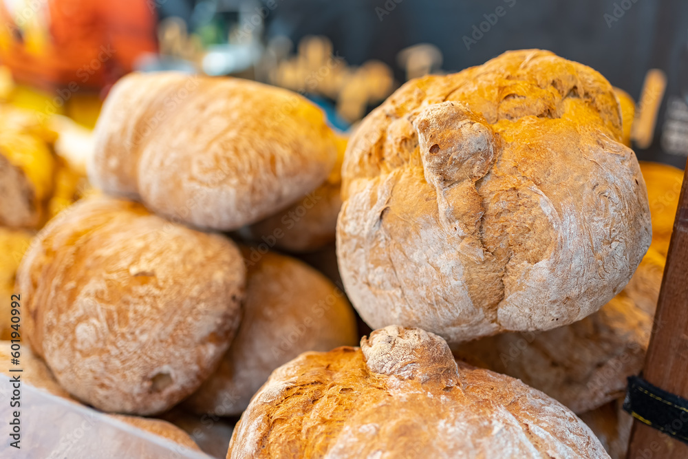 Fresh, tasty and crusty baked bread, buns and baguette on the product market in Spain