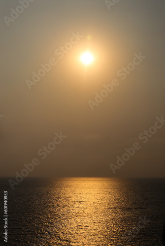 the portrait image of nature with sun sea and clear sky