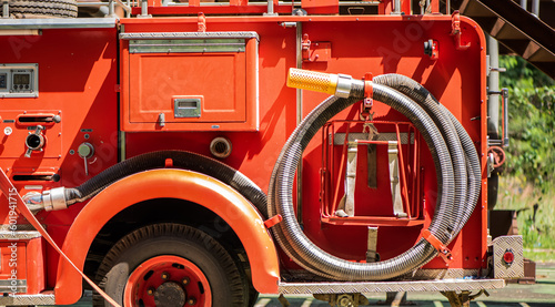 The fire hoses glistened under the sunlight symbolizing the readiness and preparedness of the fire engine to swiftly respond to any emergency that may arise.