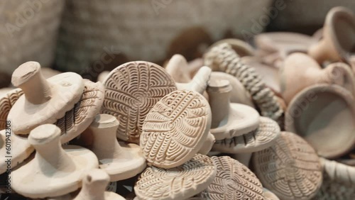 Skillful craftsman made pottery for sale in Morocco market, close up view