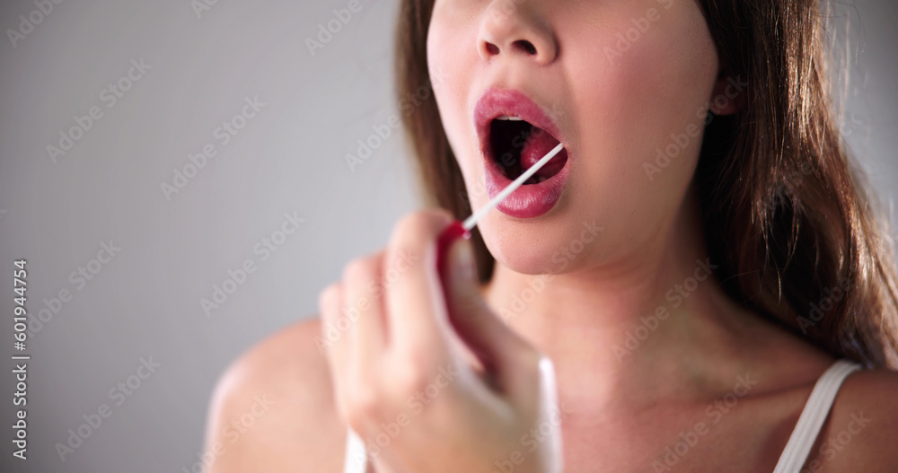 Dentist's Hand Taking Saliva Test From Woman's Mouth Dentist's Hand Taking Saliva Test From Woman's Mouth