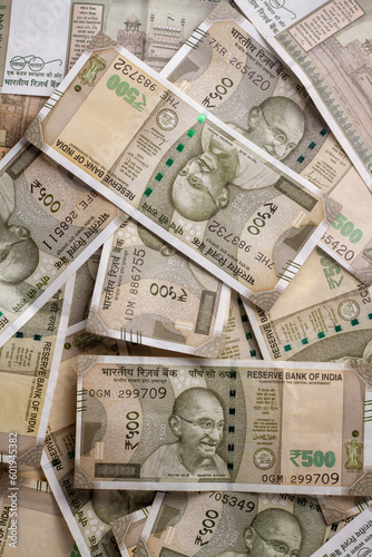 A closeup of Indian 500 rupee bills in a heap - Texture of a pile of Indian money